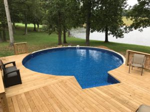 above ground pool with wood deck
