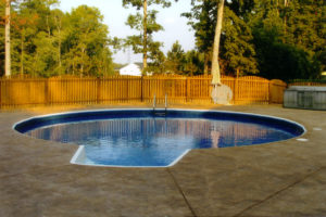 above ground pool with concrete deck
