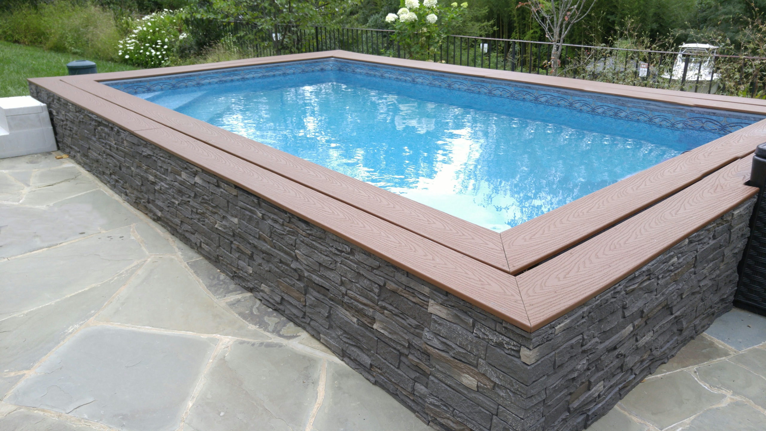 swim spa with stone surround